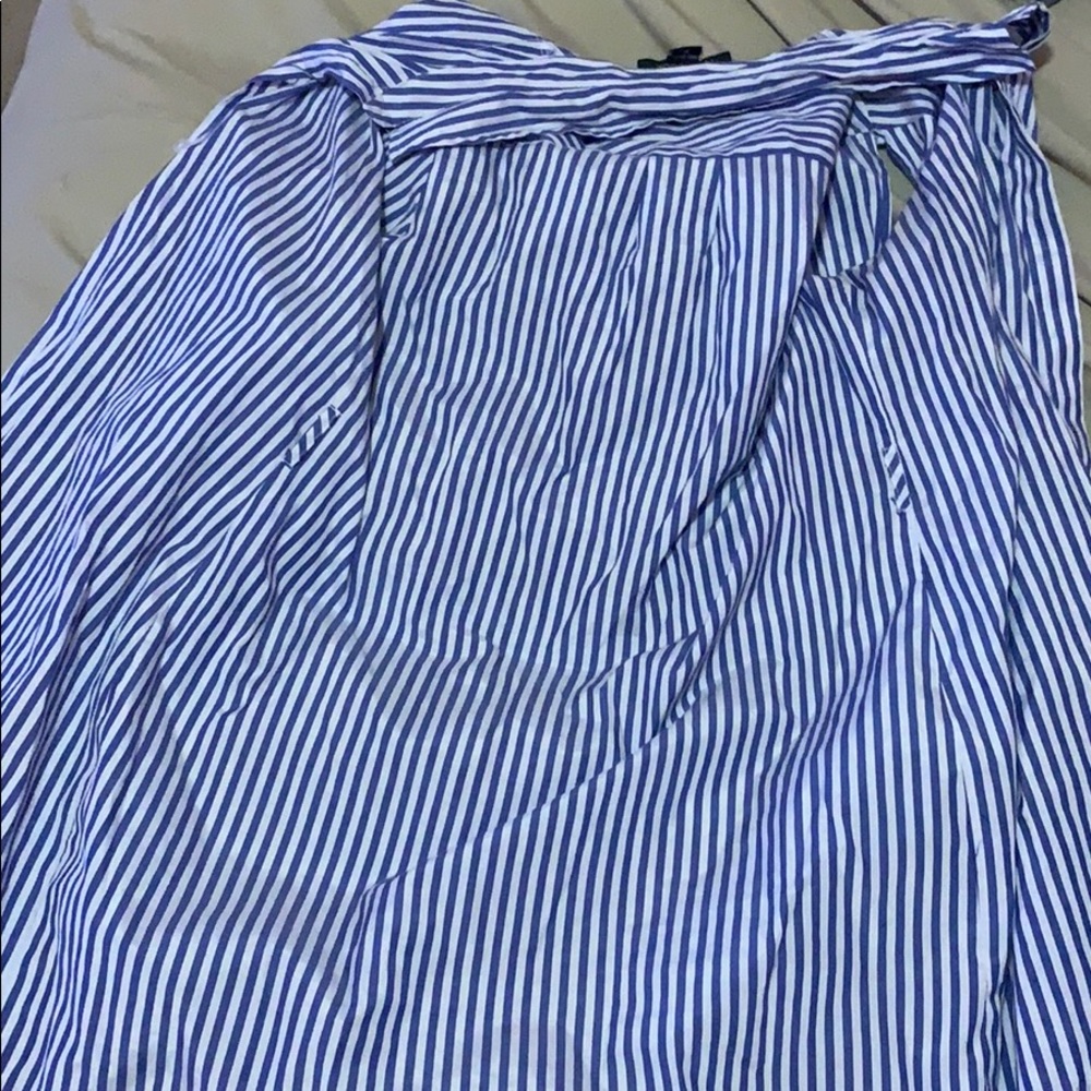 A blue and white stripped button up shirt